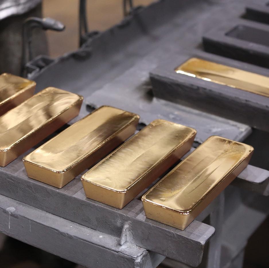 Freshly cast gold bars in a mold